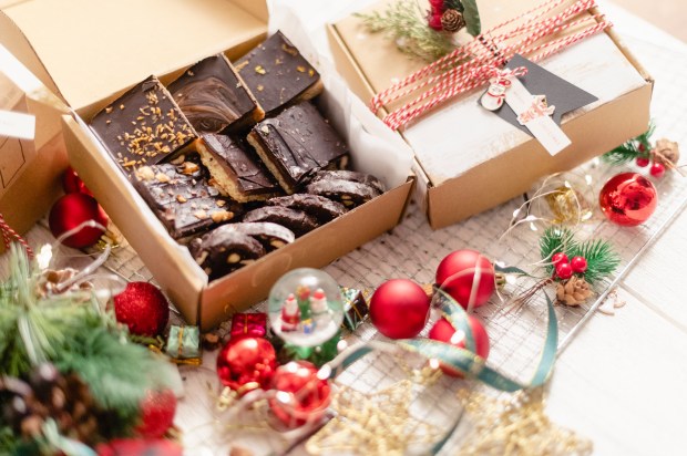 Christmas shortbread cookies in boxes with ornaments.