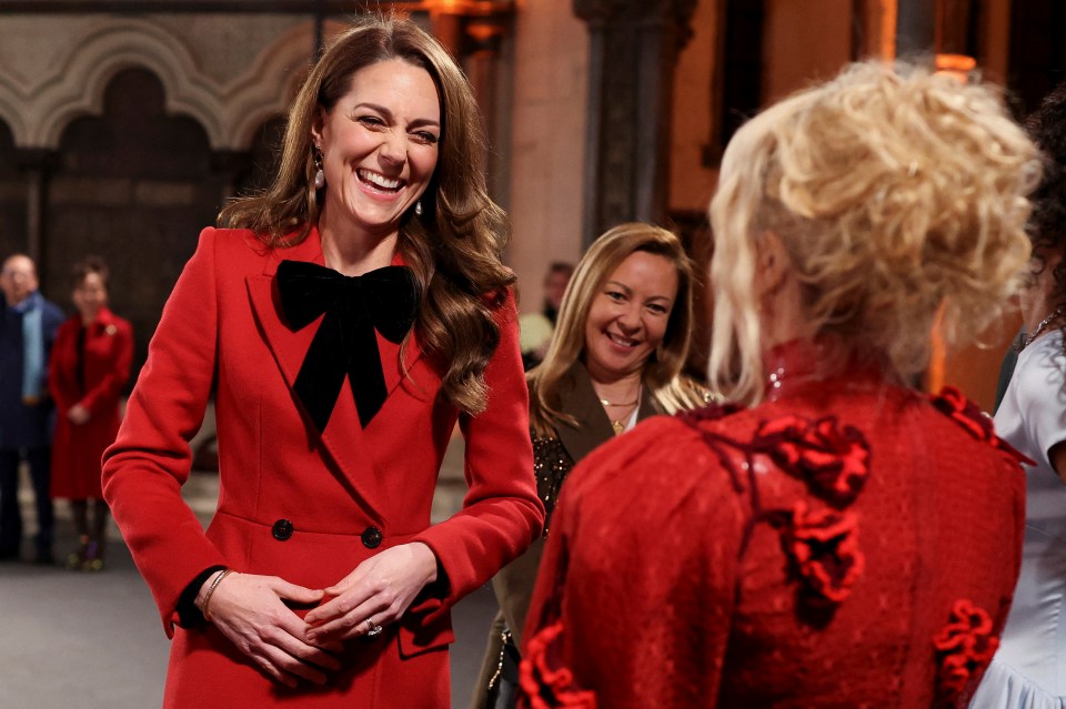 The Princess of Wales beamed wearing a red coat designed by Sarah Burton for Alexander McQueen