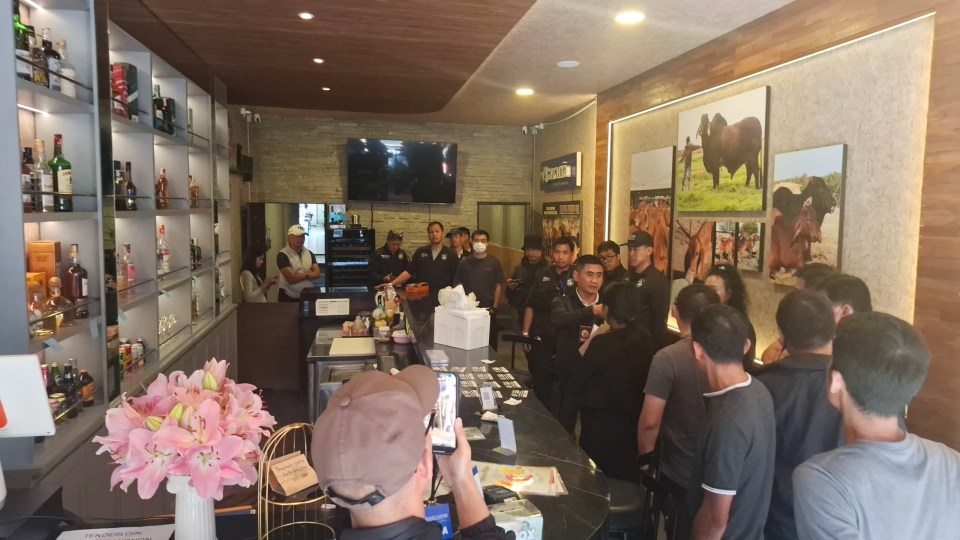 Police gathered in the luxury resort in Chang Mai where the tourist was staying