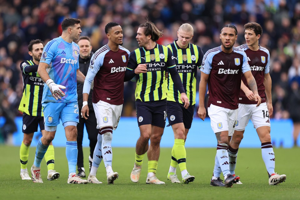 Manchester City and Aston Villa players arguing during a Premier League match.