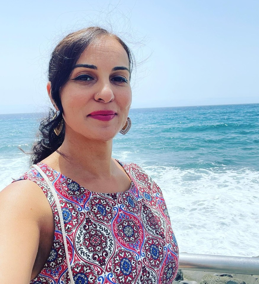 Pam Sidhu, radio host, voice artist, and mindfulness life coach, by the ocean.