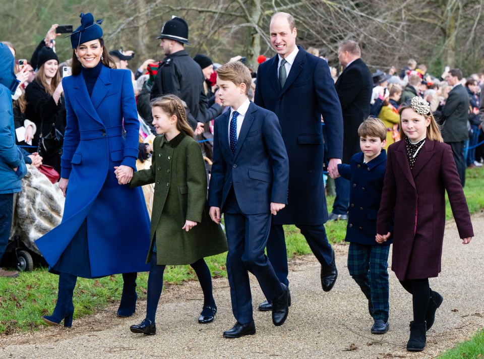 The Prince and Princess of Wales with their three eldest children walking to a Christmas service.