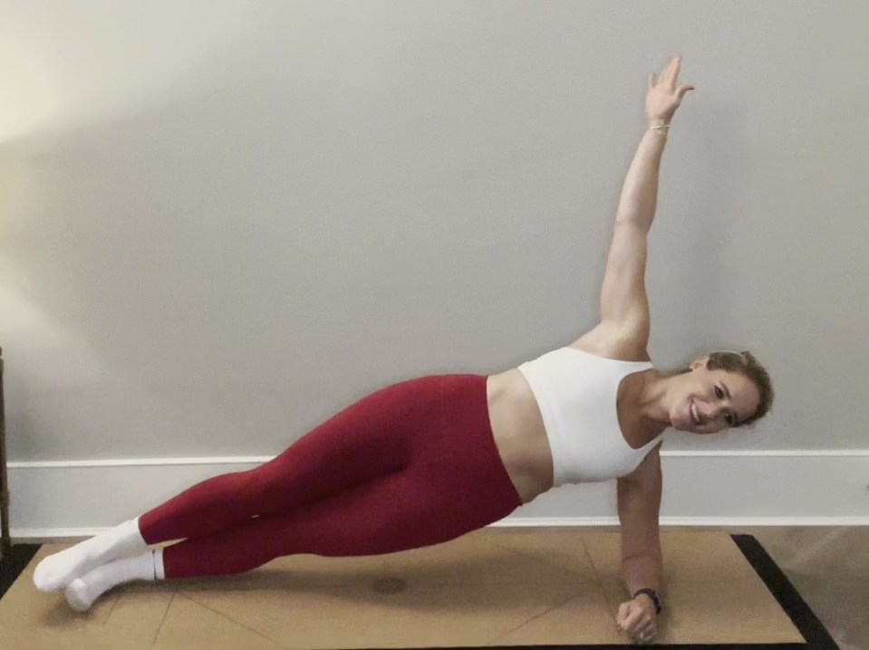 Woman doing a side plank exercise.