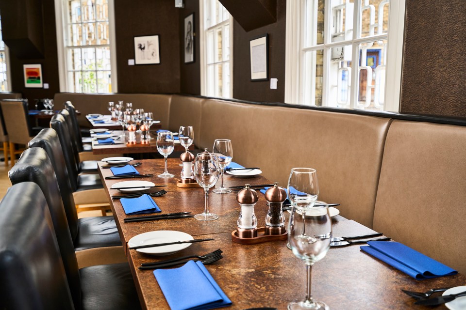 Restaurant tables set for diners.