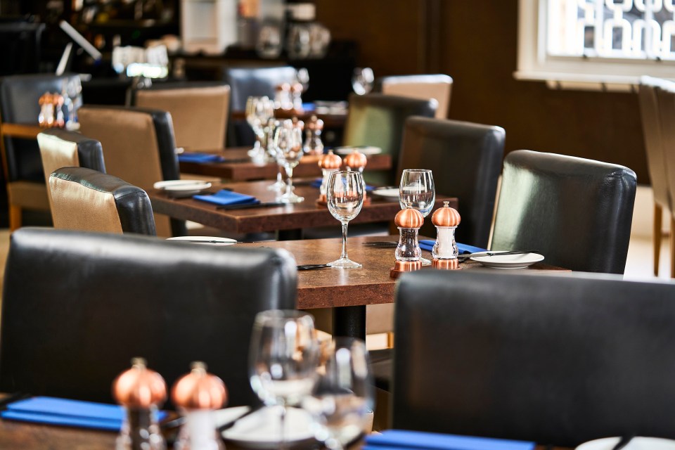 Restaurant tables set for diners.