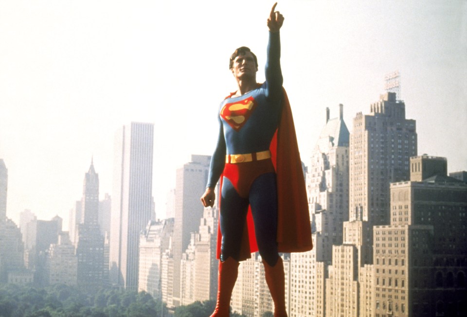 Christopher Reeve as Superman in a film still.