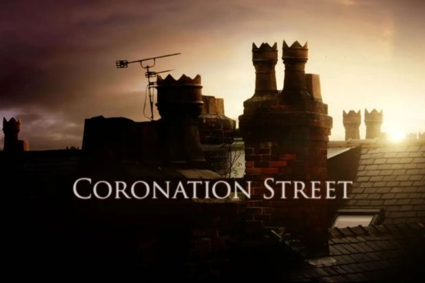 Coronation Street title card over rooftops at sunset.