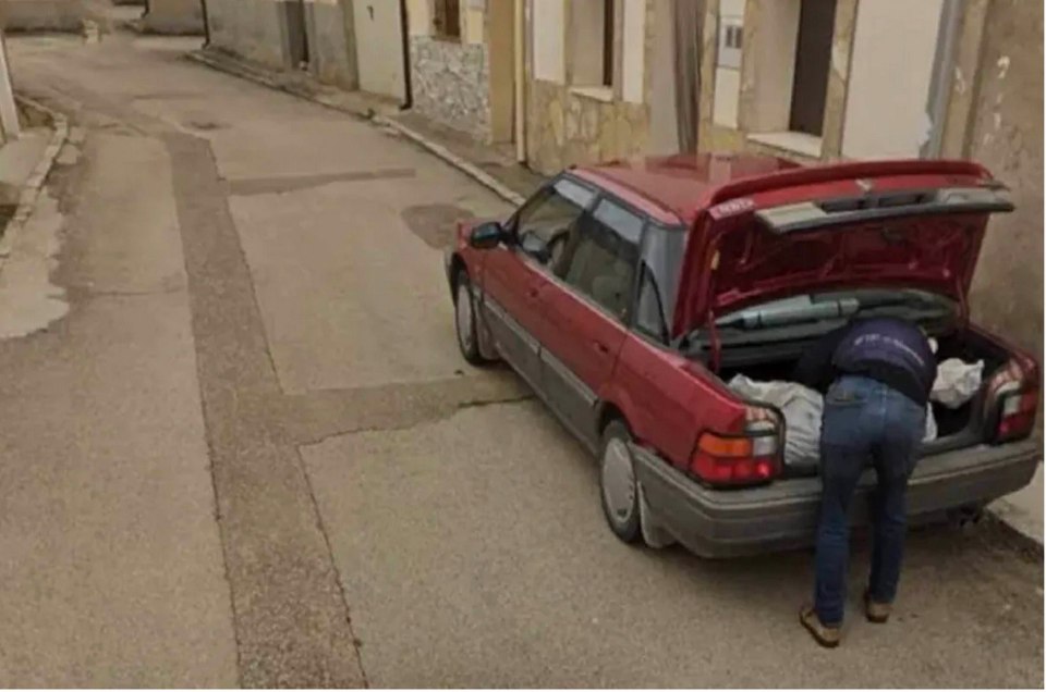 Other pictures show a man appearing to put a body into the boot of a red car in the same hamlet