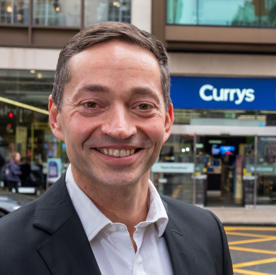 Alex Baldock, CEO of Dixons Carphone, outside a Currys store.