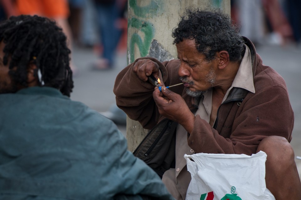 Man smoking crack cocaine in Sao Paulo, Brazil.