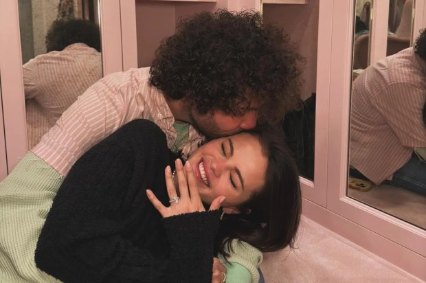 Selena Gomez and Benny Blanco embracing, she shows off her engagement ring.