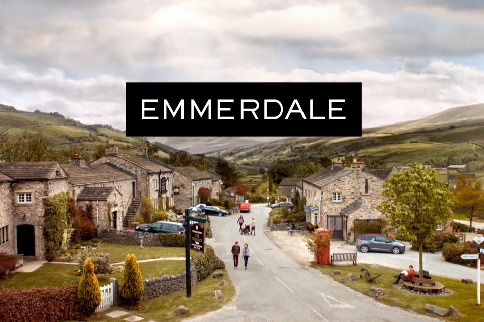 Emmerdale title card over village scene.