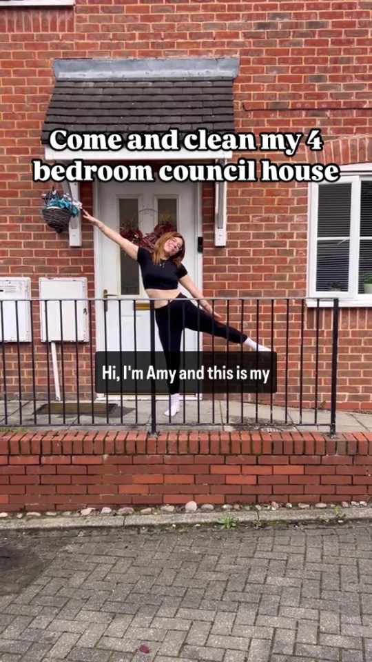 Amy standing outside her four-bedroom council house.