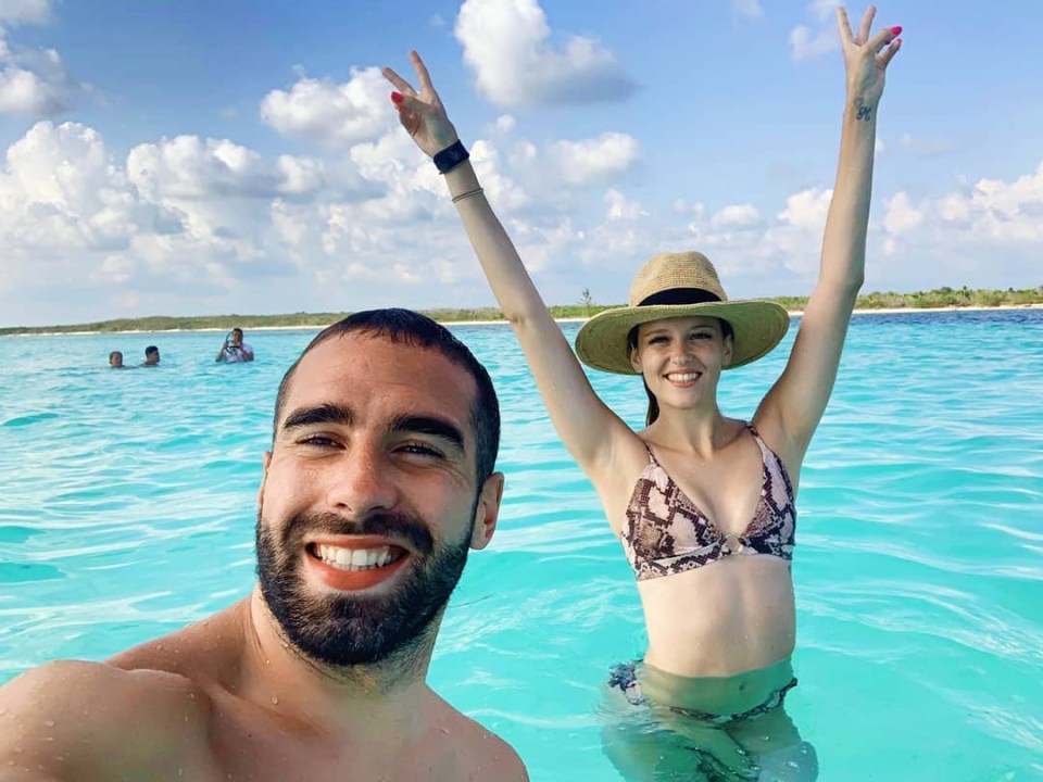 Couple enjoying a tropical vacation in clear water.