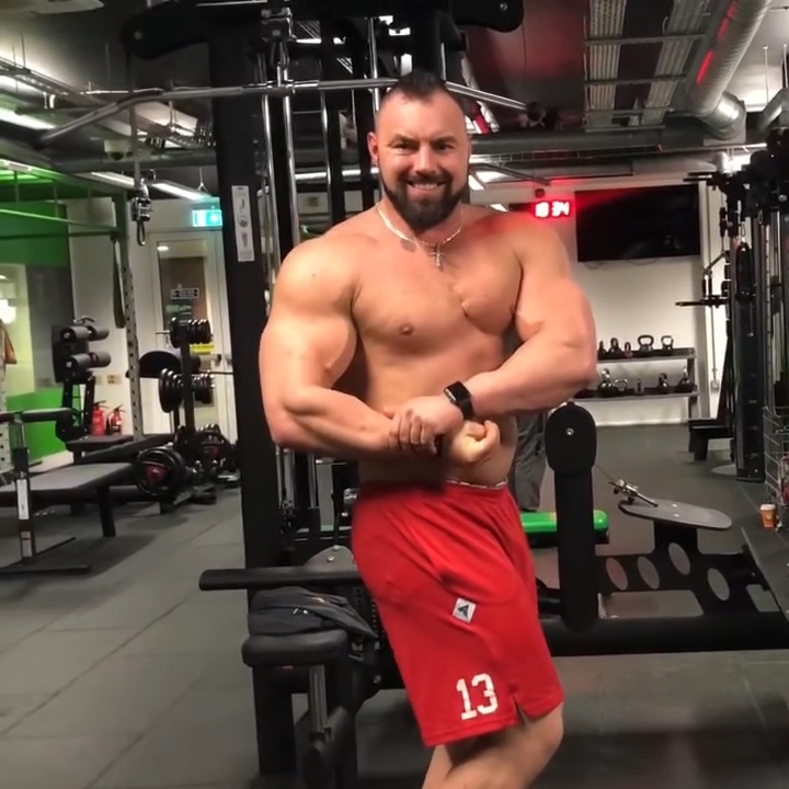 Bodybuilder Karol Olender in a gym.