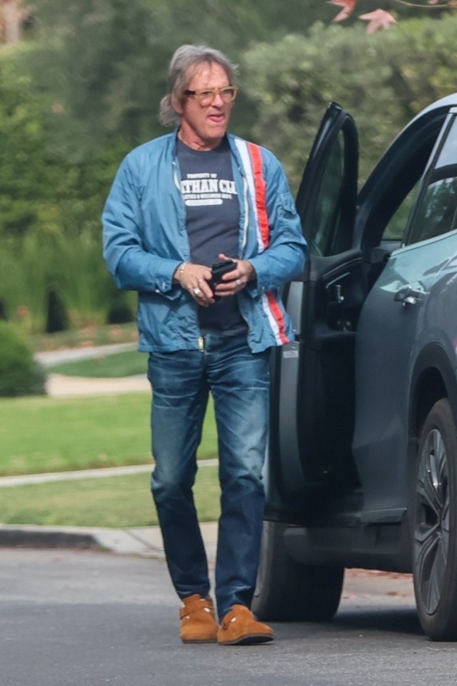 Hart Bochner, Die Hard actor, walking near his car.