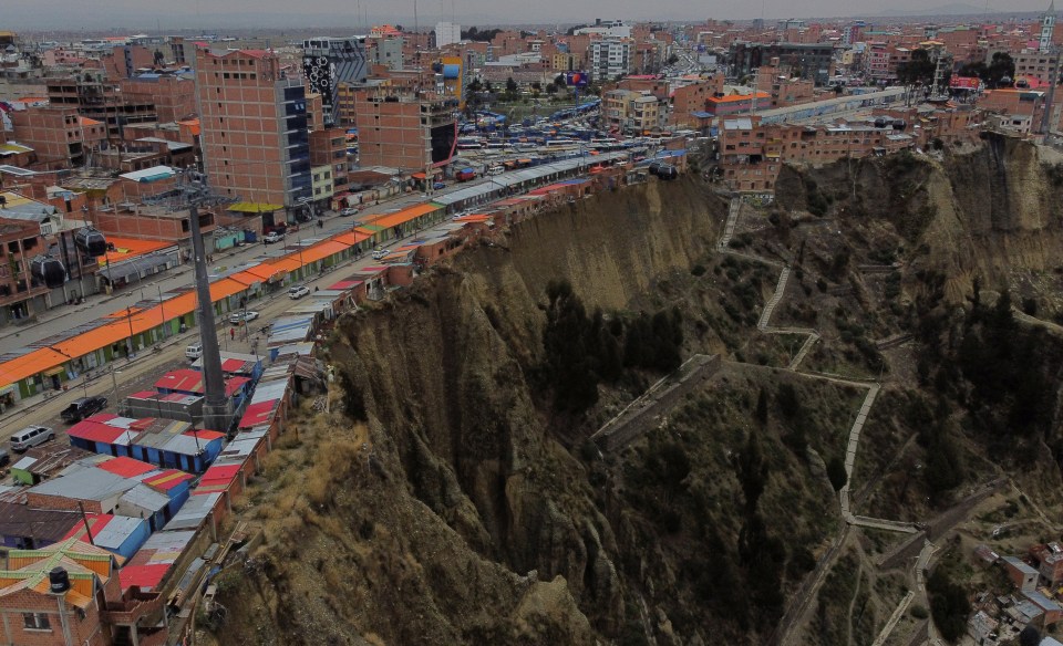 A drone view shows a row of houses, locally known as ‘suicide homes’