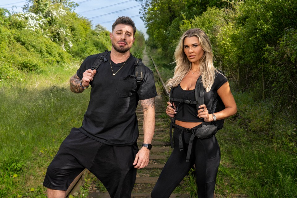 Duncan James and Christine McGuinness standing on a railway track.