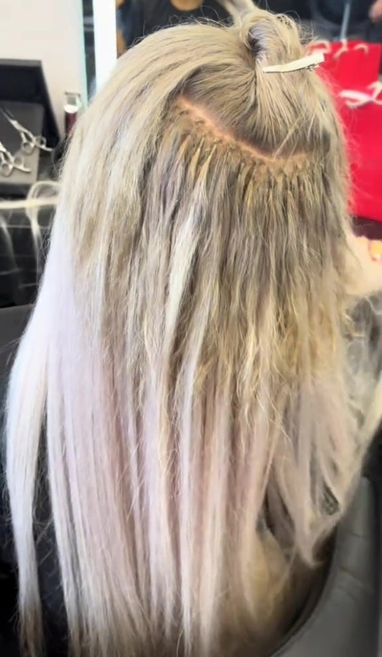 Hair extensions applied to blonde hair.