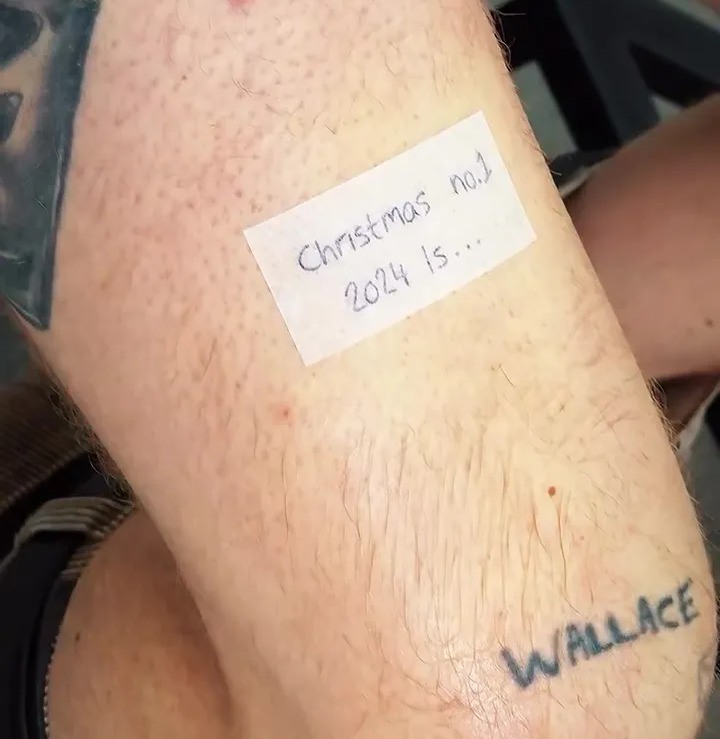 Tom's fresh marking on his leg teases: 'Christmas No.1 2024 is . . .'