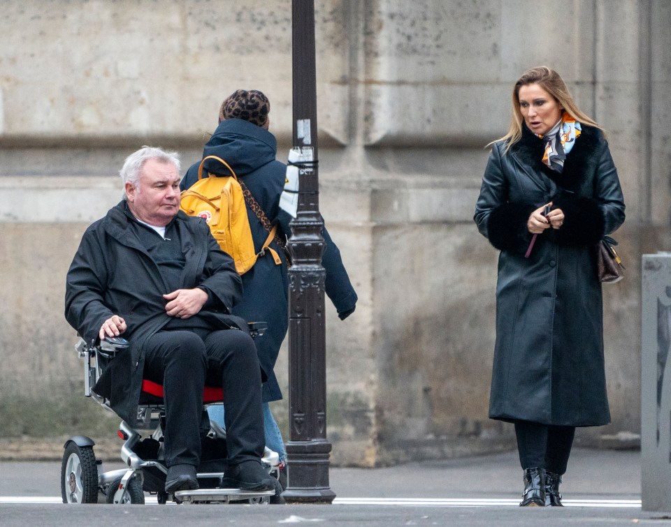 Eamonn Holmes and Katie Alexander arriving at the Louvre in Paris.  Holmes is in a wheelchair.