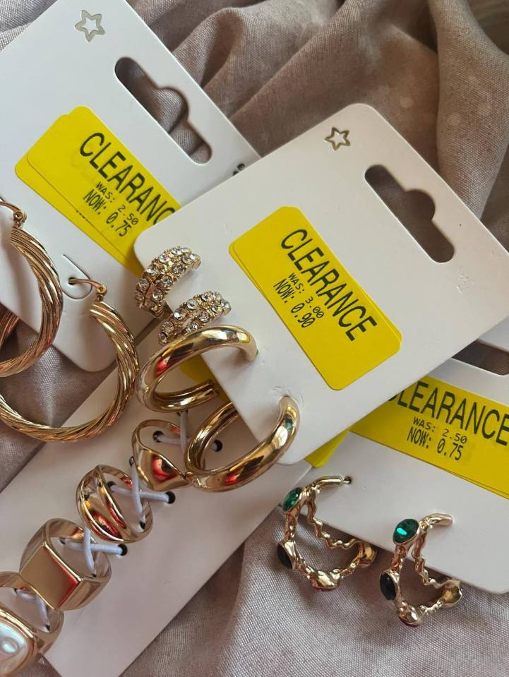 Gold and jeweled earrings and rings on clearance.