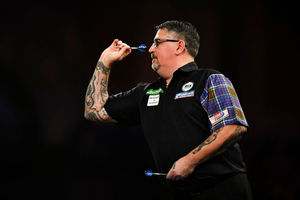 Gary Anderson throwing a dart at the PDC World Darts Championship.