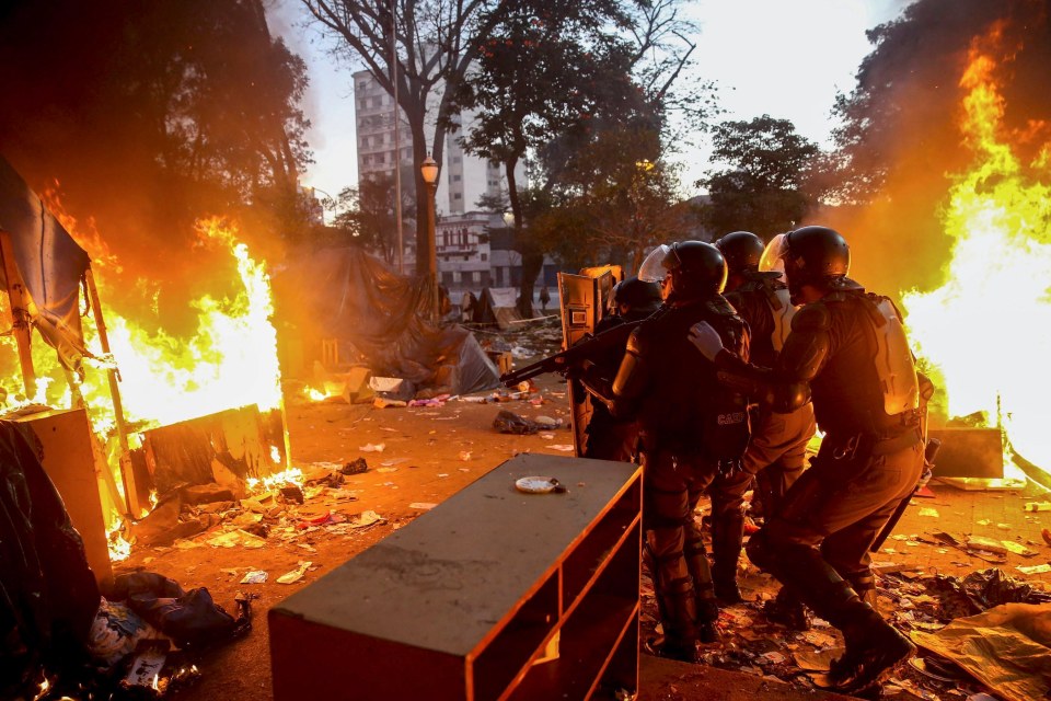 Police officers in riot gear during a drug raid in Sao Paulo, Brazil.