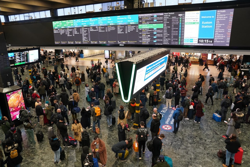 Travellers could be seen waiting for their trains to appear on the noticeboards