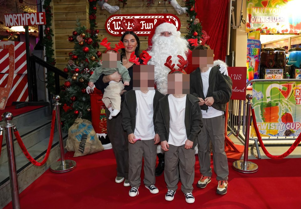 Her four boys posed for a pic with Santa