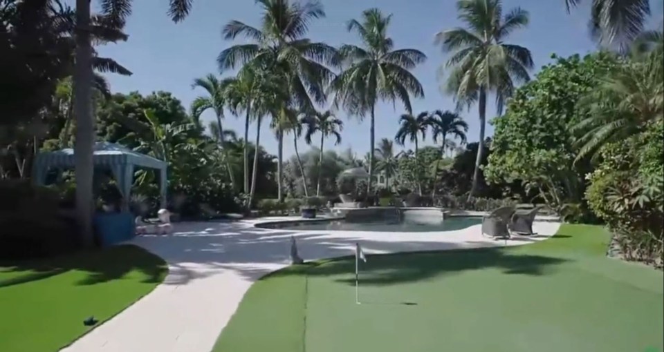 The house has a huge 1.5-acre garden with a trampoline, pickleball court and a putting green