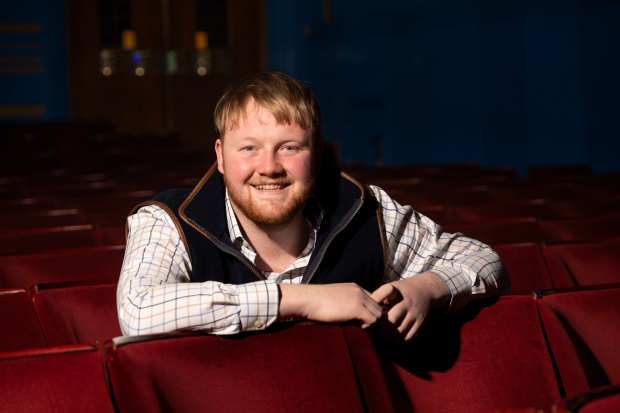 Farmer Kaleb Cooper in a theater.