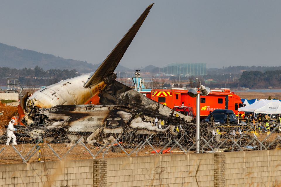 The wreckage of a burned-out passenger plane at Muan International Airport following a fatal crash.