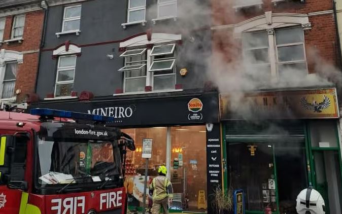 The fire ripped through a shop in North London  today