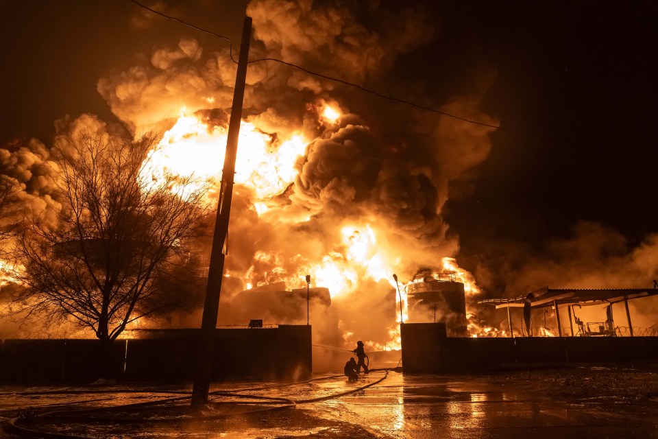 Firefighters extinguish a fire after a Russian attack on a residential neighbourhood in Kharkiv, February 2024