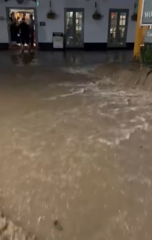 Flash flooding outside a building in the UK.