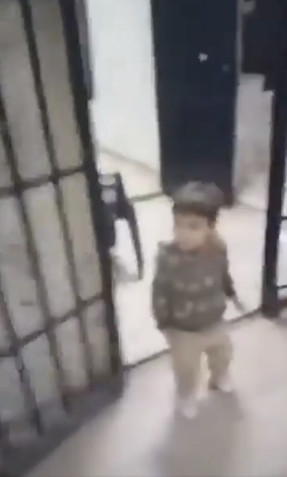 A little boy is seen leaving his cell in Syria’s infamous Saydnaya military prison