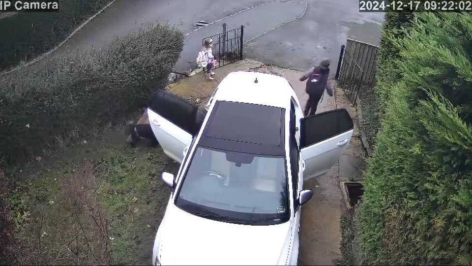 The youngster was getting ready to get into the car for the school run