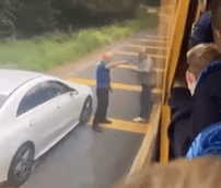 Gobsmacked students watched and filmed from inside the bus