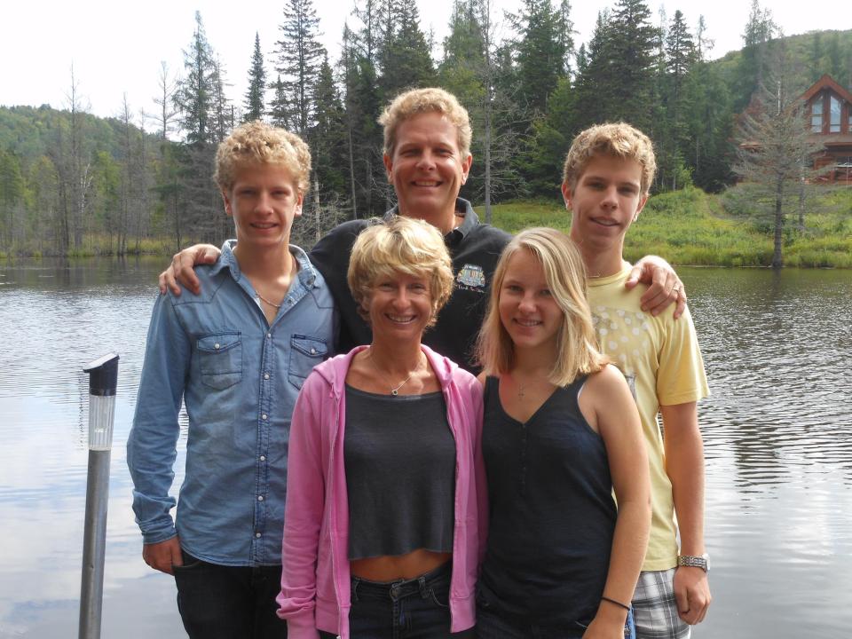 Family portrait by a lake.