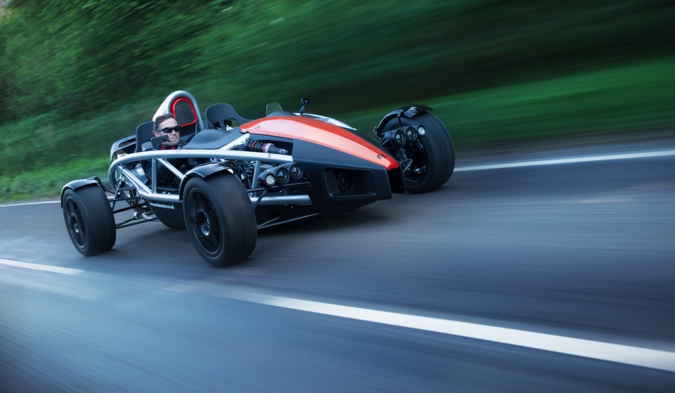 Ariel Atom 3.4 driving on a road.