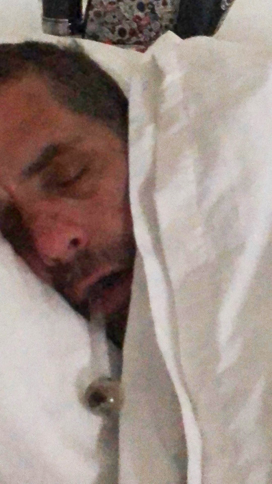 Hunter Biden seen in bed with a pipe in his mouth