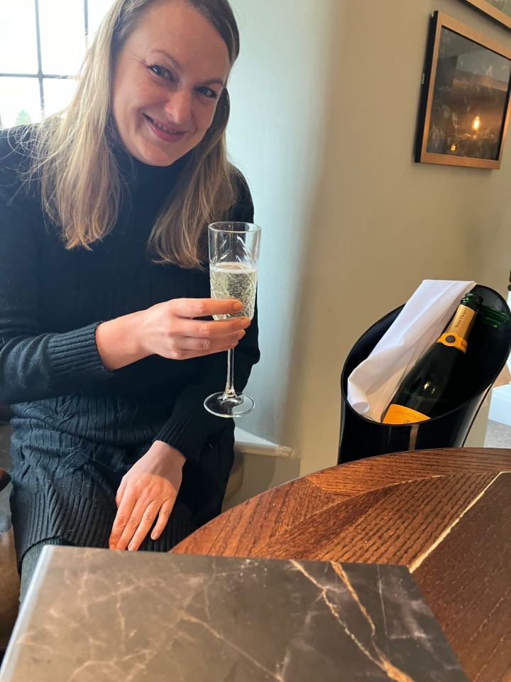 Woman on benefits enjoying champagne.