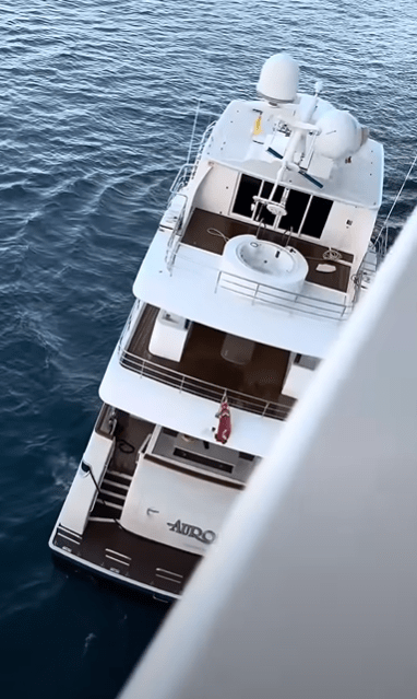 Overhead view of the Auro yacht at sea.