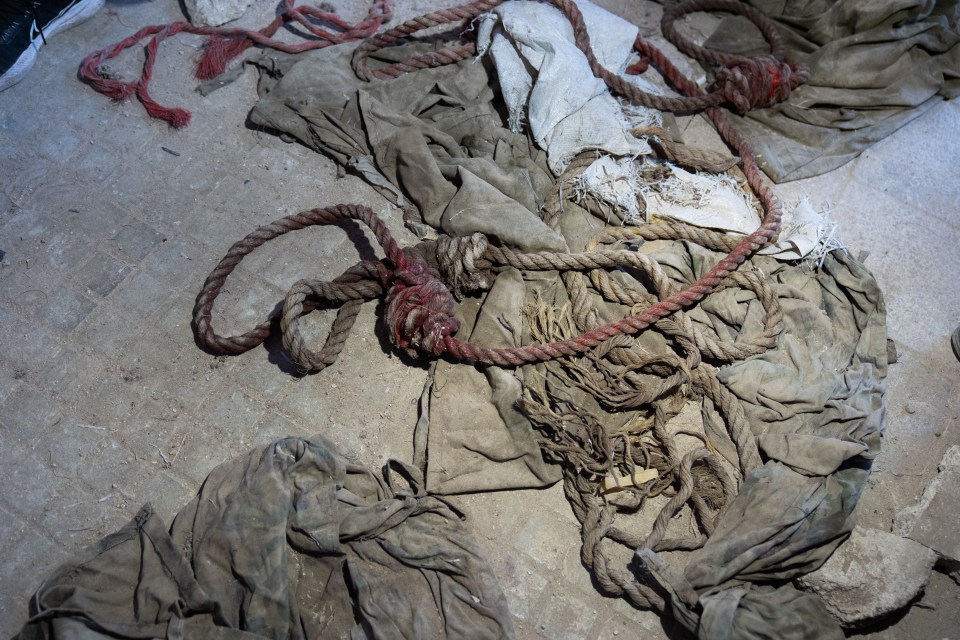 Dozens of red rope nooses used for mass hanging were also found