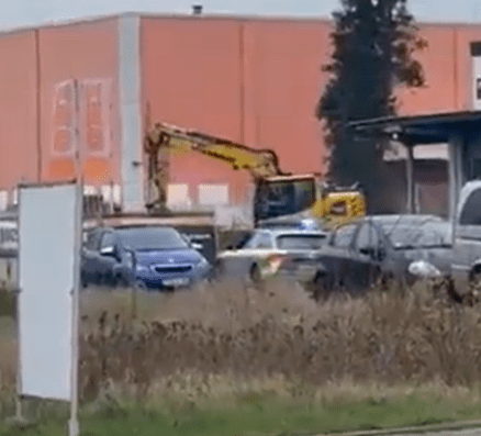 Police tried to surround the digger before taking fire