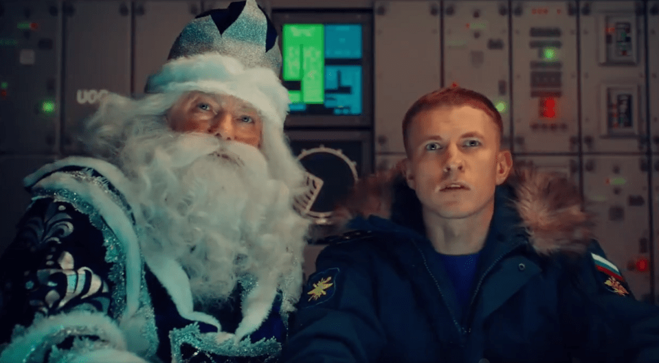 A typical Russian depiction of a blue Santa appeared to order the hit on his rival Father Christmas