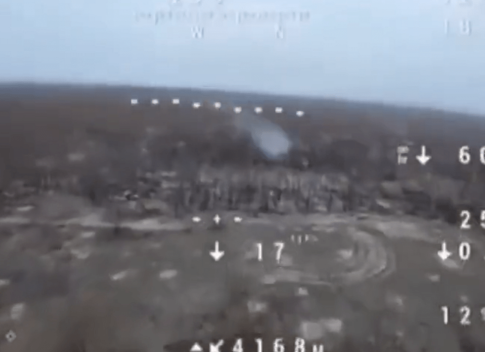 A cloud of smoke appears over the Ukrainian battlefield after a Russia drone is hit