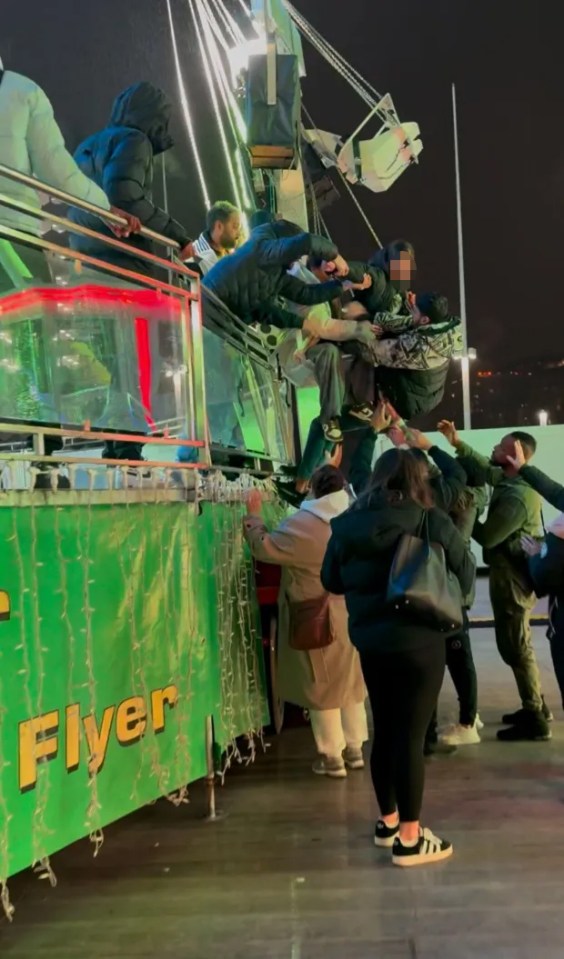 Brave bystanders help those on the ride get to safety