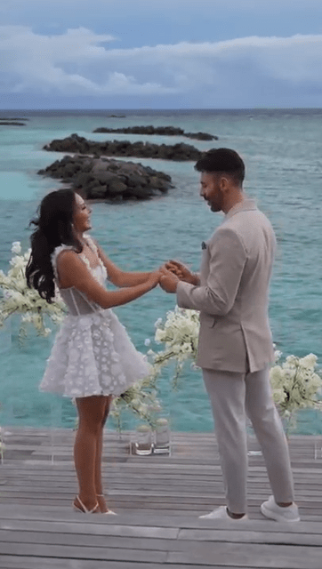 Rosie's boyfriend popped the question against an idyllic ocean backdrop